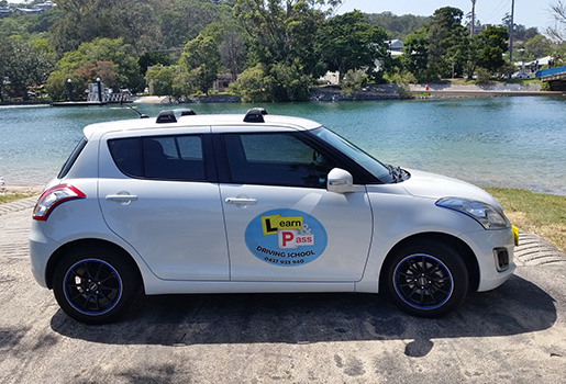white suzuki swift used by learners to pass driving school